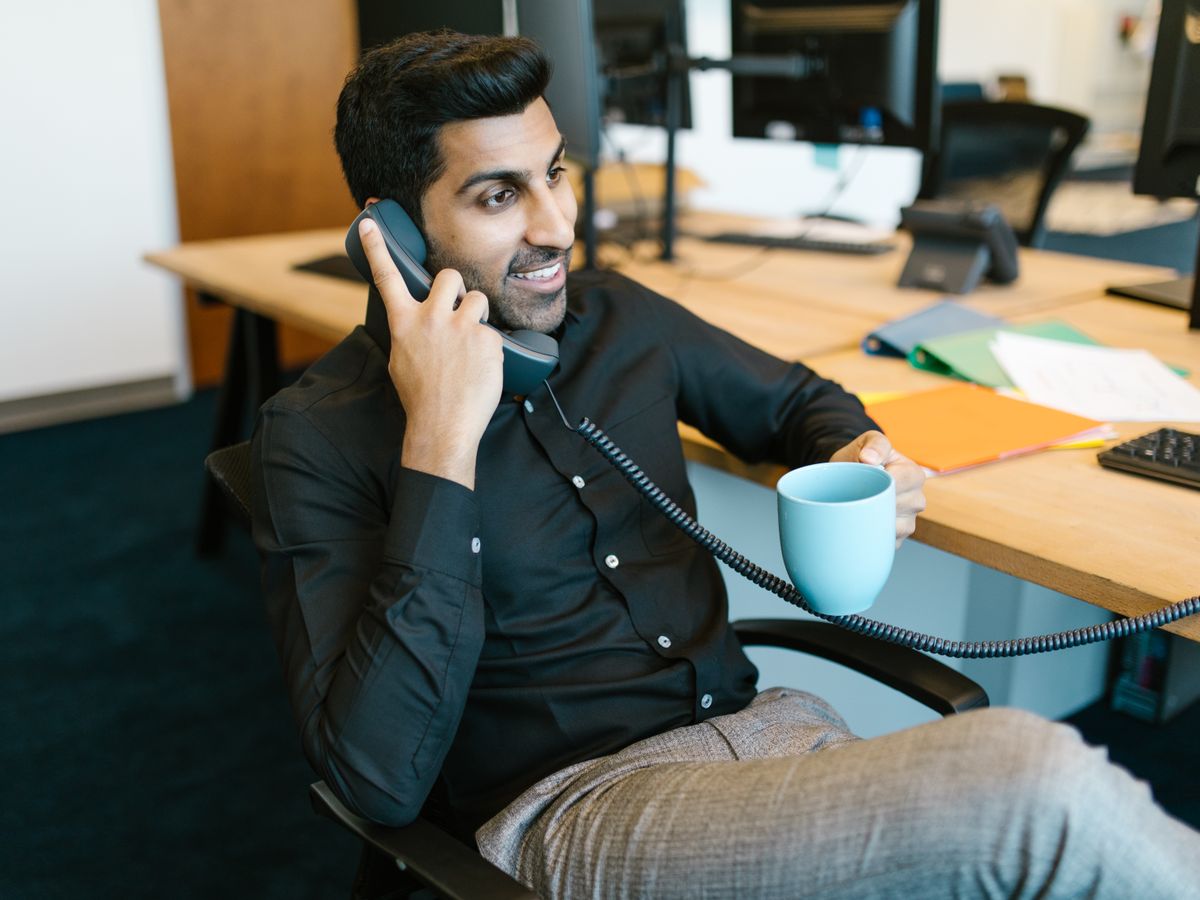 A patient counsellor calling a patient from the office